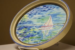 A wide array of media can be used to create impressionist art. “Blue Horizon” by Ruth Olson conveys the impression of a sailboat on the ocean with watercolors. – Hannah Dillon/Albert Lea Tribune