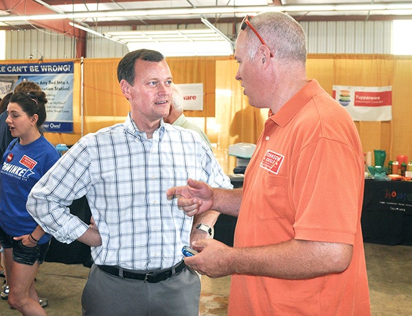Republican governor candidate Jeff Johnson talks to a supporter Saturday afternoon at the Mower County Fair. Johnson, the GOP-endorsed candidate, will face off against Minnesota businessman Scott Honour, former House Speaker Kurt Zellers and former House Minority Leader Marty Seifert in Tuesday’s primary. – Trey Mewes/Albert Lea Tribune