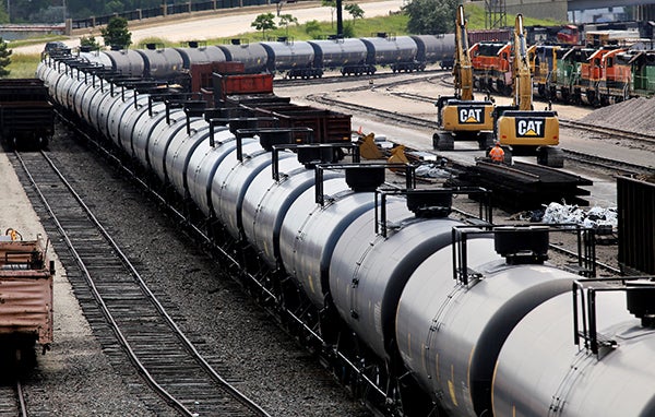 A train carrying oil cars moves through the Burlington Northern Santa Fe rail yard in Minneapolis on July 30. – Jeffrey Thompson/MPR News