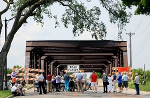 A town hall meeting on oil train transportation is held at the foot of the St. Anthony Parkway bridge in Minneapolis on July 30. The meeting, held by MN350, was intended to bring awareness to the volume and safety concerns surrounding the oil traffic traffic crossing through Minnesota from the Bakken oil fields in North Dakota. – Jeffrey Thompson/MPR News