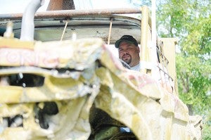 Ryan Linde looks out Saturday where the windshield would be in his modified '62 Ford truck. - Micah Bader/Albert Lea Tribune