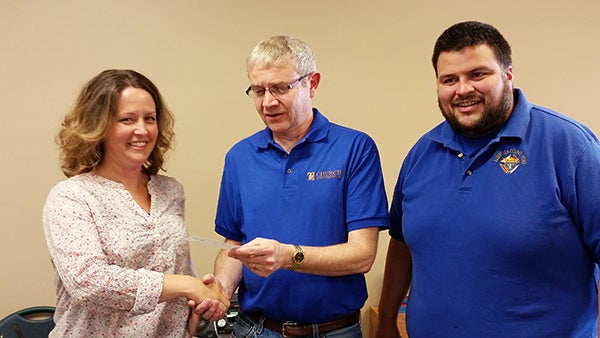 Albert Lea Knights of Columbus awards a check to Freeborn County ARC Director of Development Amy Vogt. This represents the proceeds from the Knights of Columbus annual Tootsie Roll Fundraiser. Presenting the check are Dan Bodensteiner and Ben Lares. – Provided