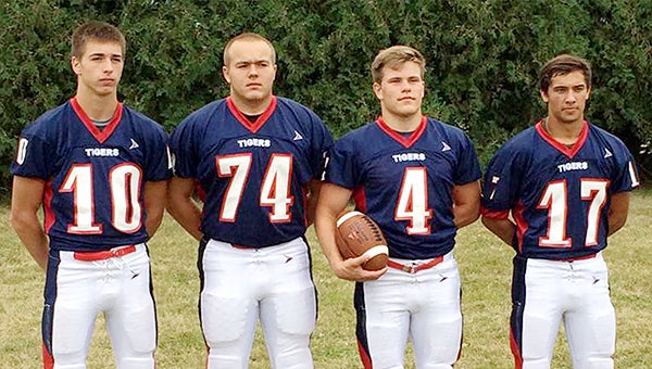 Captains of the Albert Lea football team stand together for a preseason photo. From left are junior quarterback Jake Kilby, senior lineman Matt Nemec, senior running back Tim Christianson and senior defensive back Sam Thompson. After a scrimmage at 10 a.m. Saturday at Mankato East, the Tigers will play their season opener at 7 p.m. Aug. 28 at Mankato West. — Provided