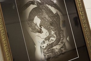 A number of photographs of tattoos were present in the body art show, including “Dragonback” by Julie Bronson. – Hannah Dillon/Albert Lea Tribune