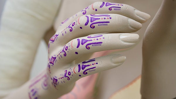 Intricate designs are painted on “Oceana”’s hand, though Susanne Crane, one of the artists who worked on the mannequin, said her design may change by the time the show is completed. – Hannah Dillon/Albert Lea Tribune