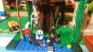 Forrest has these three fellows, a dog and a frog swimming with guns and sharp objects at the base of a Lego treehouse he built.