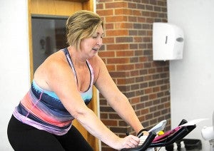 Kelly Hendrickson, a spinning instructor at the Albert Lea Family Y, teaches a class on Aug. 11.