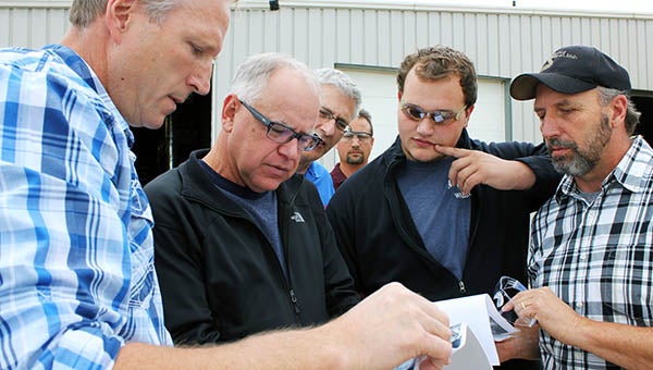Tom Bunz, operations manager for Pro Manufacturing, left, shows 1st District U.S. House Rep. Tim Walz plans for a World Trade Center building involving some parts constructed in Albert Lea. Looking on from right are Dan DeBoer, owner and president of Pro Trucking and Pro Manufacturing; DeBoer’s son, Bryce; Chad Severtson, operations manager with Pro Trucking; and John Hausladen, president of the Minnesota Trucking Association. – Sarah Stultz/Albert Lea Tribune