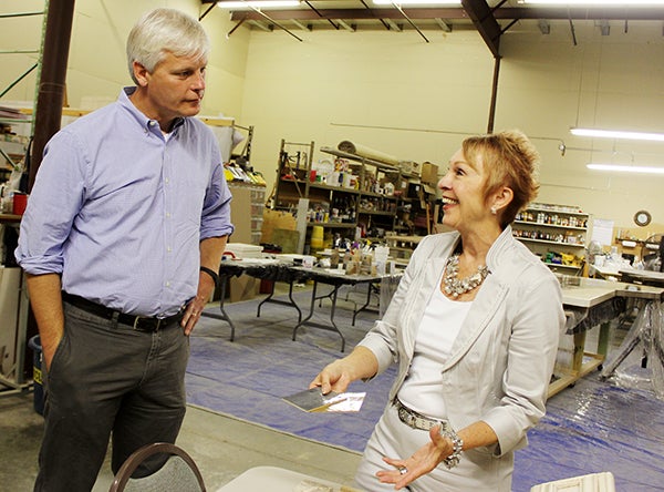 Speaker of the House Paul Thissen, DFL-Minneapolis, listens Thursday morning as Granicrete Minnesota co-owner Jean Eaton talks about a decorating project for one of her clients. – Sarah Stultz/Albert Lea Tribune