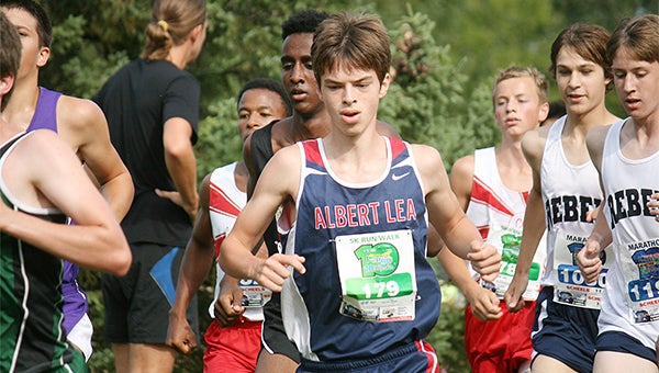 Caleb Troe of Albert Lea runs Friday at the St. Olaf High School Showcase in Northfield. In a race with 674 participants, Troe was one of three Tigers to finish in the top 100. — Bryce Gaudian/For the Albert Lea Tribune