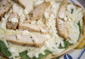 Tribune photographer Colleen Harrison made up some pizza for the grill, topped with mozzarella and feta cheese, spinach and grilled chicken. — Colleen Harrison/Albert Lea Tribune