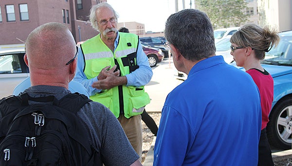Transportation expert Dan Burden speaks with a group of Albert Lea residents Thursday morning in downtown Albert Lea. He praised the reconstruction of downtown and had ideas to further improve the place. – Tim Engstrom/Albert Lea Tribune
