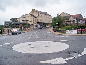An example of a mini-roundabout in the United Kingdom. – Wikimedia