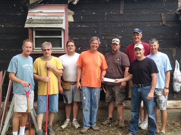 The Albert B. Cuppage Foundation was established in 1976.  It was Albert B. Cuppage’s desire and vision to give back to the community he loved.  The foundation has provided support for a variety of worthy causes including education, religious and charitable purposes and continues to impact many lives in the community. Pictured, from left, are Ken Petersen, volunteer; Roger Poplow, homeowner; Jim Gold, volunteer; Jim Troe, Shinefest chairman and volunteer; Travis Quam, volunteer; Don Savelkoul, Cuppage trustee; Mark Smed, volunteer; and Kevin Dulitz, cuppage trustee. – Provided