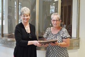 Carol Adair Brune presented her mother’s scrapbook to Pat Mulso. — Provided