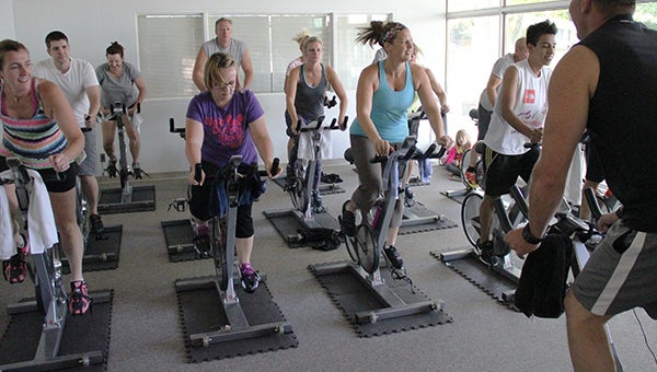 words of an instructor in a spinning class Monday at the Albert Lea Family Y. The class is one of many fitness classes offered. – Tim Engstrom/Albert Lea Tribune