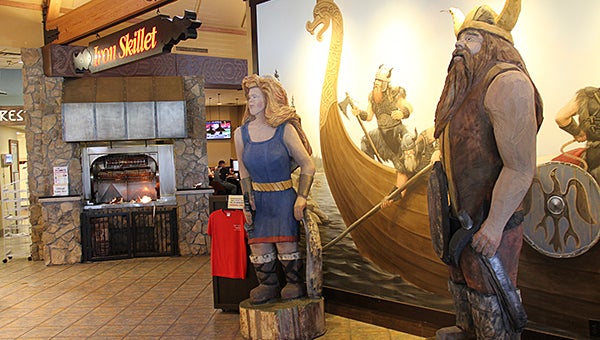 Vikings Ole and Lena and a viking mural greet customers to Trail’s Travel Center near the entrance to the Iron Skillet restaurant. Nearby is a wood-burning rotisserie. – Tim Engstrom/Albert Lea Tribune