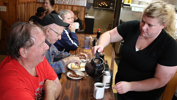 Waitress Crystal Bagley pours coffee for Howard Schewe Saturday morning at B&B Cafe, where service is prompt. – Tim Engstrom/Albert Lea Tribune