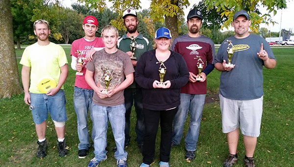 Champions of the fall league for the Flying Lea Disc Golf Club stand with their trophies on Sept. 24 at Riverland Community College. From left are Gaylen Wachlin, fourth on the amateur division; Matt Nessett, third in amateur; Jeremiah E, first in the recreational division; John Lerum, third in the pro division; December Moore, first in the women’s division; Zach Godtland, second in the amateur division; and Mike Tabor, first in the pro. Not pictures are Matt Friedman, second in pro; Ray Besco, fourth in pro; Buck Monson, fifth in pro; Lars Tonding, first in amateur; and Tyler E, fifth in amateur. Places are determined with a points race that rewards good scores and attendance. Interstate Packaging is the club’s sponsor. — Provided