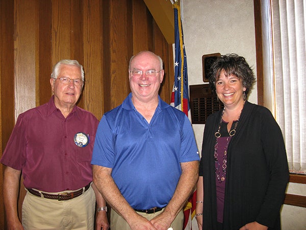 Gayln Short is the newest member of the Noon Kiwanis Club. He is standing with his sponsor Duane Troe and past president Angie Eggum during his induction. – Provided