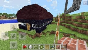 Forrest Engstrom built this house with a wraparound glass window in “Minecraft: Pocket Edition.” It is next to a railroad he and I built and a large monument he built so that he could spot his house from far away, should he become lost.