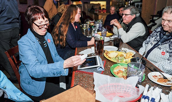 Rep. Jeanne Poppe looks at some early results at El Mariachi’s Tuesday night. Poppe retained her seat agains Dennis Schminke. – Eric Johnson/Albert Lea Tribune