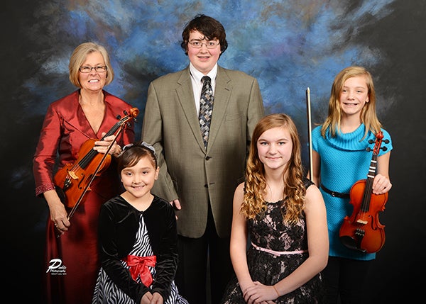 Albert Lea Art Center will host the Festival of Trees at 1 p.m. Sunday at Northbridge Mall. Young musicians will perform from 1 to 2:30 p.m. Pictured, from left in the back row, are Sharon Astrup-Scott, Michael Blong and Elise Grzybowski. Pictured, from left in the front row, are Kyra Habana and  Anna Dahl. Not pictured is Cali Mowers. – Provided