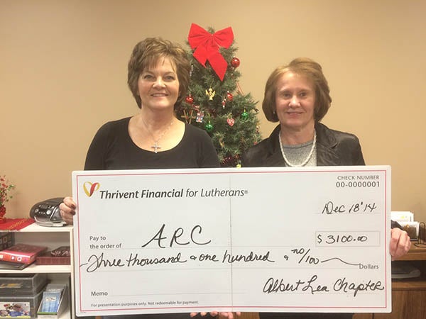 Jo Lowe. right, program director for the Arc of Freeborn County, accepts $3,100 for funds raised for the soup and chili supper from Barb Rehmke, records director of the Albert Lea chapter of Thrivent. – Provided
