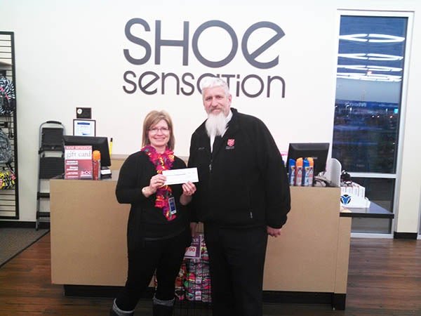 Shoe Sensation’s Store Manager Karla Tukua presents a check for $234.38 to Capt. Jim Brickson of Albert Lea’s Salvation Army. Funds were raised from Dec. 2 through Dec. 8. Customer’s made donations of $1 or more and saved 10 percent off a single item. – Provided
