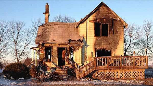 The sun shines on a burned-out house this morning north of Bricelyn. The place, which burned Monday night, was the home to Doug Pike and his dogs. – Michele Beyer/Albert Lea Tribune