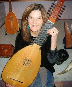 Lauren Pelon holds an archlute, one of the many instruments she plays. The archlute is a European stringed instrument developed around 1600. Provided