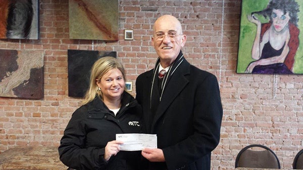 Lori Broghammer, area manager for ITC Midwest, presents a check to Albert Lea-Freeborn County Chamber Foundation for downtown winter decorations. – Provided