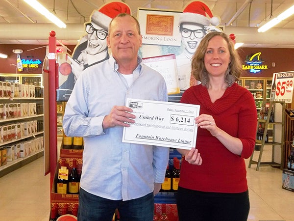 Ann Austin of United Way of Freeborn County says thank you to Fountain Warehouse Liquor for their partnership in putting on a wine tasting event this year. This year’s event raised $6,214. – Provided