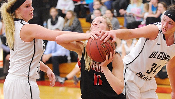 Anna Stork of NRHEG stays strong in the paint Tuesday at home against Blooming Prairie. — Micah Bader/Albert Lea Tribune