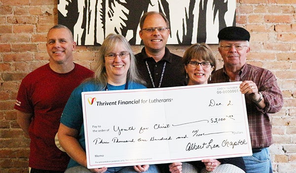 Thrivent representatives presented Youth For Christ’s The Rock with supplementary funding from Thrivent Financial for the Lutheran Albert Lea Chapter. Pictured in the back row are Rick Miller, Greg Gudal and Larry Trampel. Pictured in the front row are Kelli Fiscus and Robin Gudal. – Provided