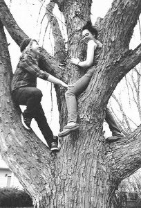 Best friends Shannon Zwanziger, left, and Sara Higgins climb a tree together. The girls met shortly after they moved to Owatonna, about three-and-a-half years ago. – Provided