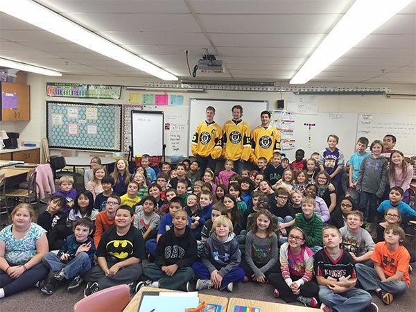 Three Austin Bruins hockey players visited with fourth graders from Lakeview Elementary on Nov. 25. The players read with the students, then talked about healthy life habits. — Provided
