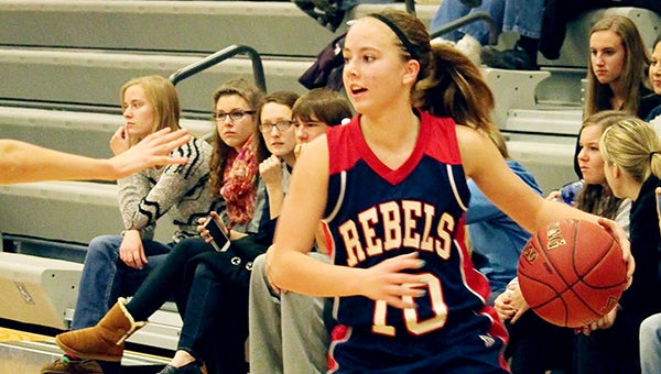 Taylor Schultz looks for an open teammate Friday during a 51-45 loss against Waterville-Elysian-Morristown at Wells. Schultz had two points, two rebounds and two steals. The Rebels trailed 7-0 to start the game but built a seven-point second-half lead before falling. USC (0-2 overall) has led at halftime in both of their games. — Kelly Hendrickson/For the Albert Lea Tribune