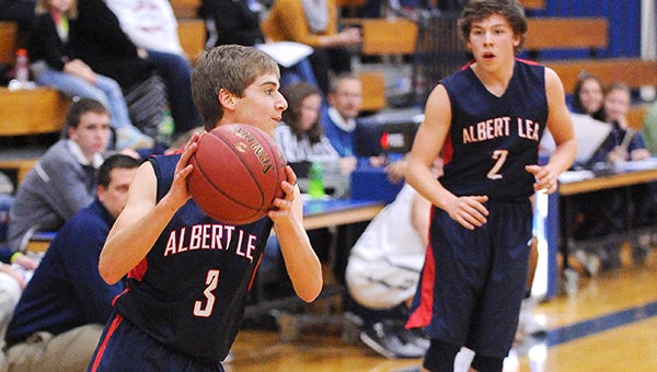 Jake Thompson of Albert Lea looks for an opening in the paint Tuesday against Rochester Century at Albert Lea. — Micah Bader/Albert Lea Tribune