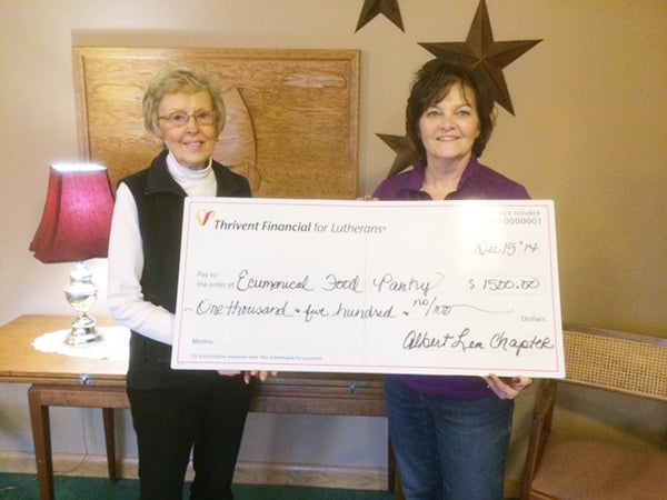 Dorothy Simonsen from Ecumenical Food Pantry accepts $1,500 from Barb Rehmke, records director from the Albert Lea Chapter of Thrivent. – Provided