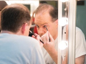 Scott Bryant applies makeup before performing in the opening night of “A Dickens’ Christmas Carol: A Traveling Travesty in Two Tumultuous Acts” as Teddy Shub.