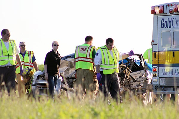 Emergency personnel respond to a double fatality on Interstate 35 one mile north of the Iowa border on May 28. – Sarah Stultz/Albert Lea Tribune