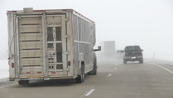 A pickup hauling a trailer begins to pass traffic on eastbound Interstate 90 east of Alden. -- Tim Engstrom/Albert Lea Tribune