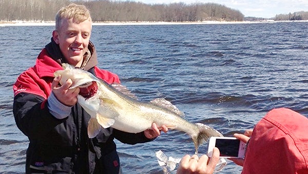 An unknown Albert Lea resident poses with a walleye he caught during catch-and-release season on the Rainy River between Baudette and International Falls in early April of 2014. When the lone fisherman realized he didn’t have a way to record the catch, he shouted over to a nearby boat. The boat’s captain, Patrick O’Kane of Maple Grove, maneuvered his boat next to the unknown man’s boat, and Joe O’Kane of Woodbury jumped into the man’s boat with a tape measure. The fish was 32.75 inches long with a girth that exceeded 17.5 inches and had an estimated weight of 14 pounds. After taking the measurements and photo, the unknown fisherman released the fish unharmed. Joe wants to contact the Albert Lea fisherman to find out if he had a replica mount made of the fish. If any information is available about this Albert Lea angler, please email tribsports@albertleatribune.com. — Provided