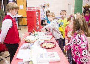 Hollandale Christian School students browse through the Fesitval of Nations at the school Thursday. — Colleen Harrison/Albert Lea Tribune