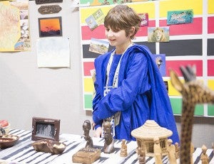 Jon De Haan, a fifth-grader at Hollandale Christian School, did a presentation on Zimbabwe for the school's Festival of Nations. He said he chose that country because his mother went on a mission trip there, and that he himself was born in Kenya, a neighboring country. — Colleen Harrison/Albert Lea Tribune