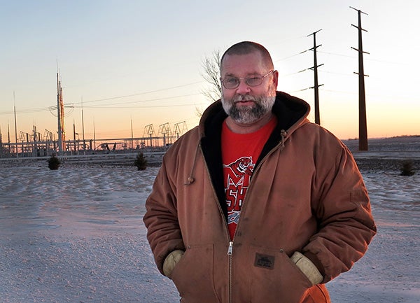 Chuck Muller is not happy that a solar energy project may be built next to his house near Marshall in southwest Minnesota. He says he already has an electrical substation and many power lines near his property. - Mark Steil/MPR News