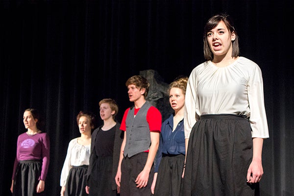 Bailey Ford, one of the narrators, and other cast members of “The Murder of Lidice” recite their final lines of the play on Tuesday during rehearsal at the Albert Lea High School auditorium. - Hannah Dillon/Albert Lea Tribune