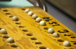 Bingo numbers written on balls are placed into their corresponding places on this board as they are called Wednesday during a game of bingo at St. Theodore Catholic School. - Sarah Stultz/Albert Lea Tribune