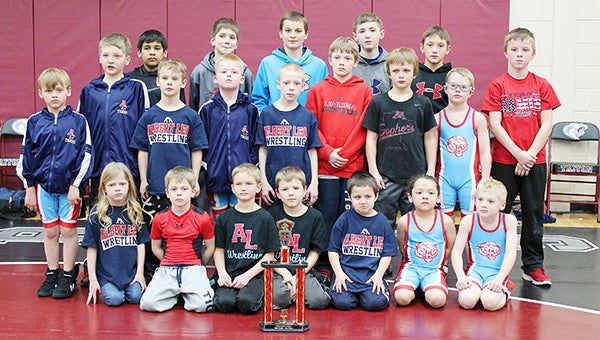 Members of Albert Lea’s youth wrestling program from kindergarten through sixth grade are pictured with their trophy Jan. 18 at the Triton Youth Dual Tournament at Montgomery. The Tigers took second place. Front row from left are Maggie Olson, Logan Davis, Brody Ignaszewski, Nick Korman, Ledger Studier, William Velasquez and Caden Forman. Middle row from left are Hayden Christenson, Kadin Indrelie, Aivin Wasmoen, Alex Palmer, Mike Olson, Cameron Davis, Blake Braun, Teaghan Tolbers and Cole Glazier. Back row from left are Christian Leal, Garrett Giles, Josiah Hedensten, Griffin Studier and Caleb Talamantes. — Provided